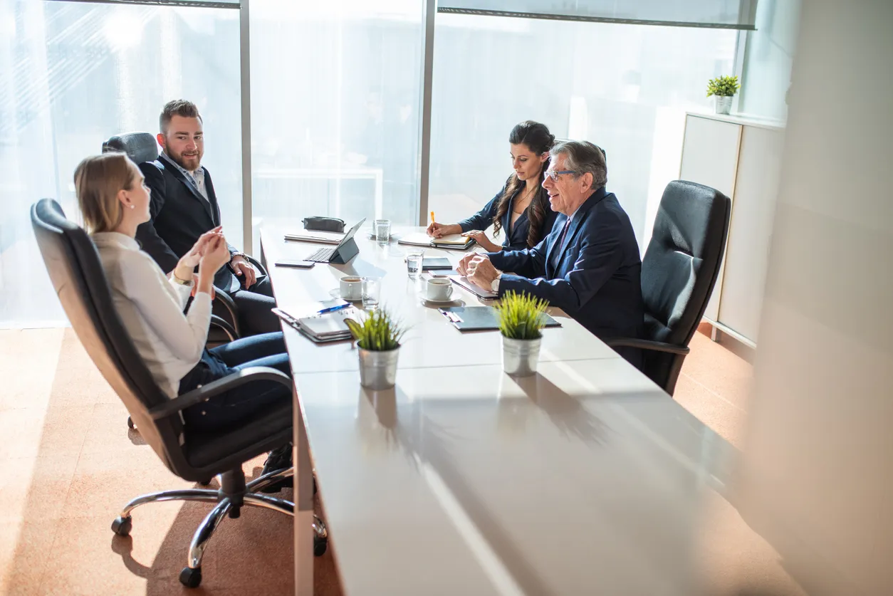 professionals around a modern office table