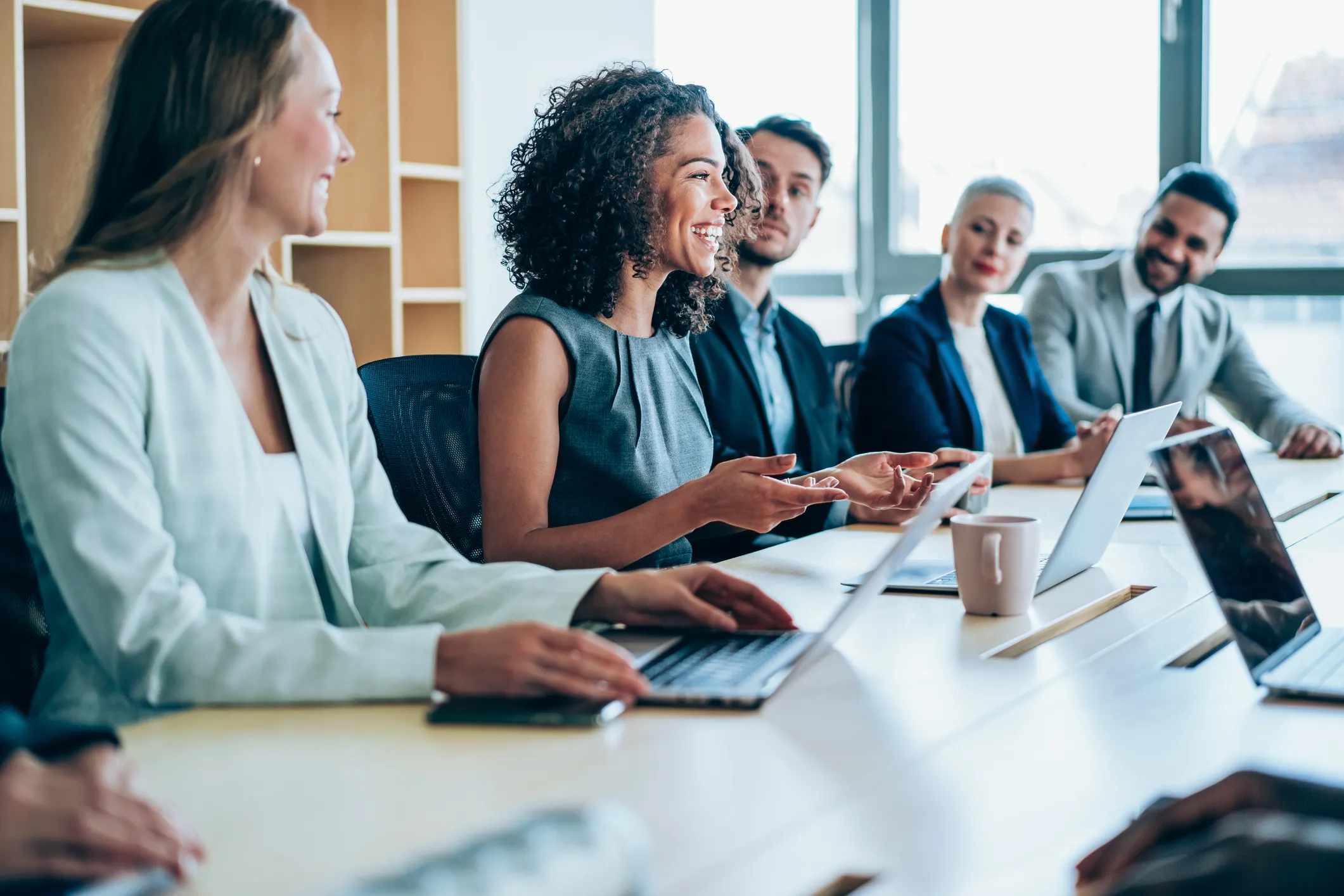 legal professionals around a meeting table