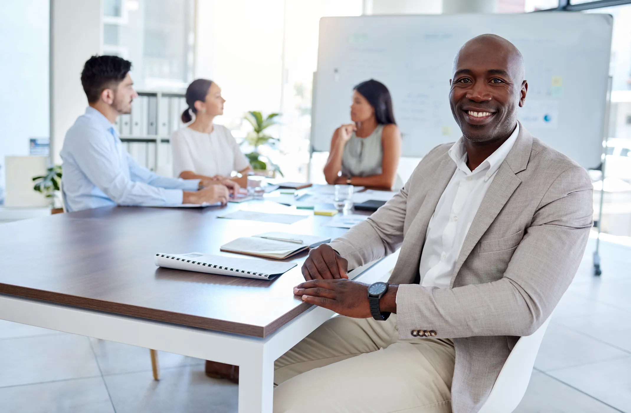 legal professionals around a meeting table