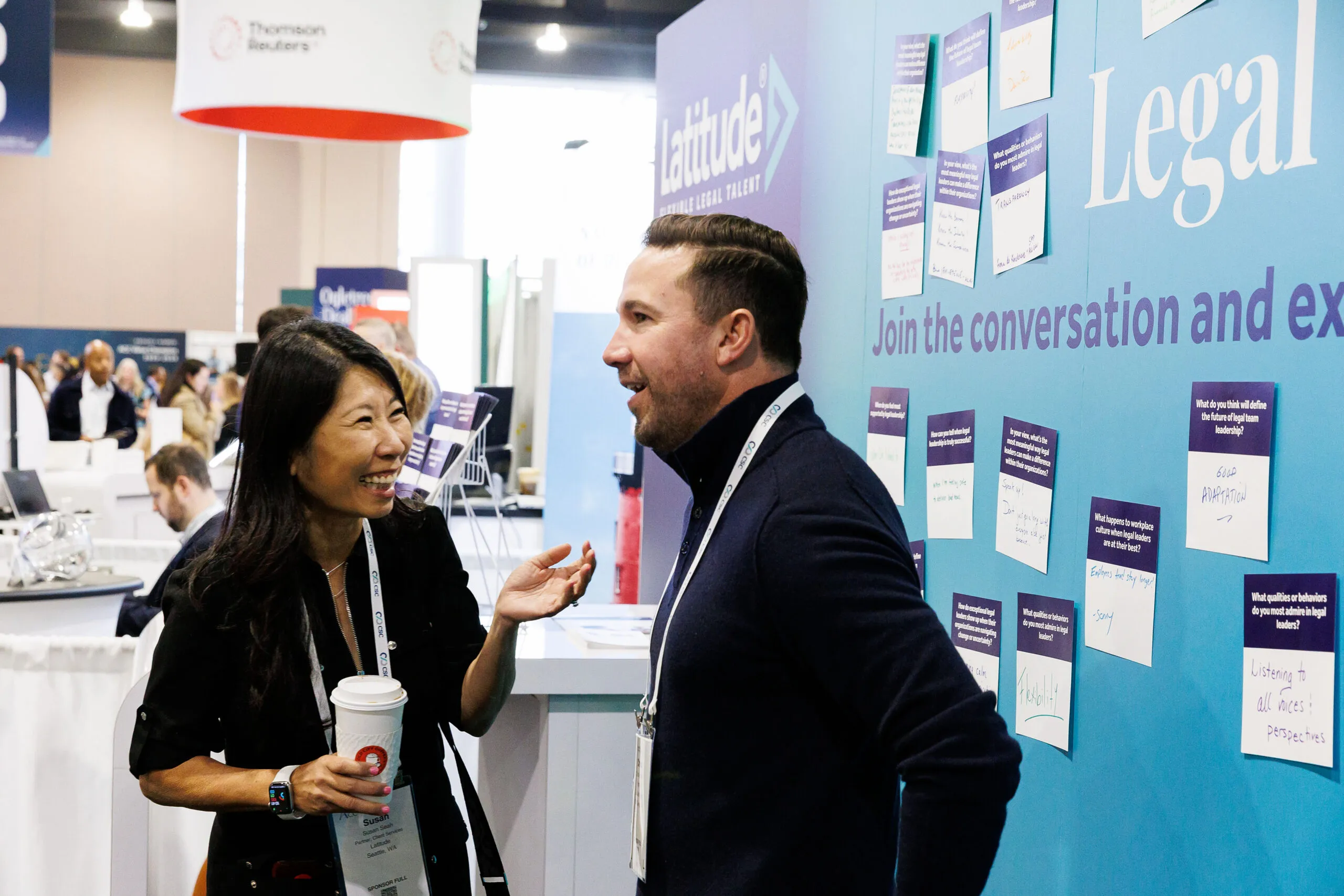 professionals speaking to one another at a conference