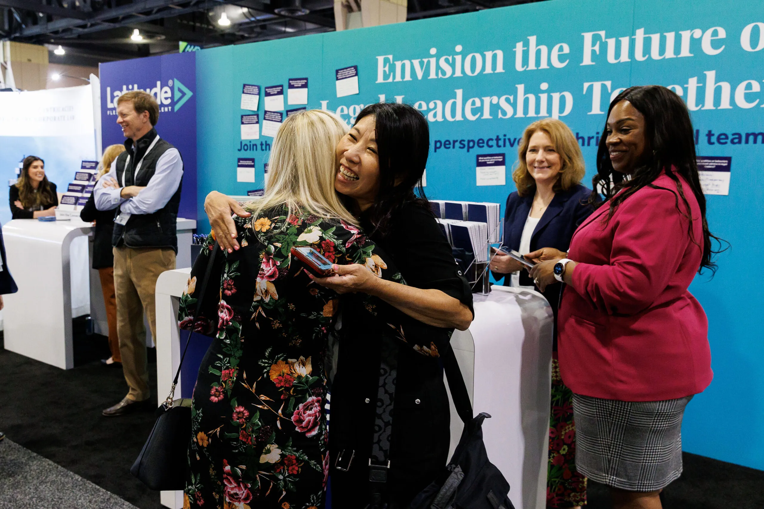 professionals speaking to one another at a conference
