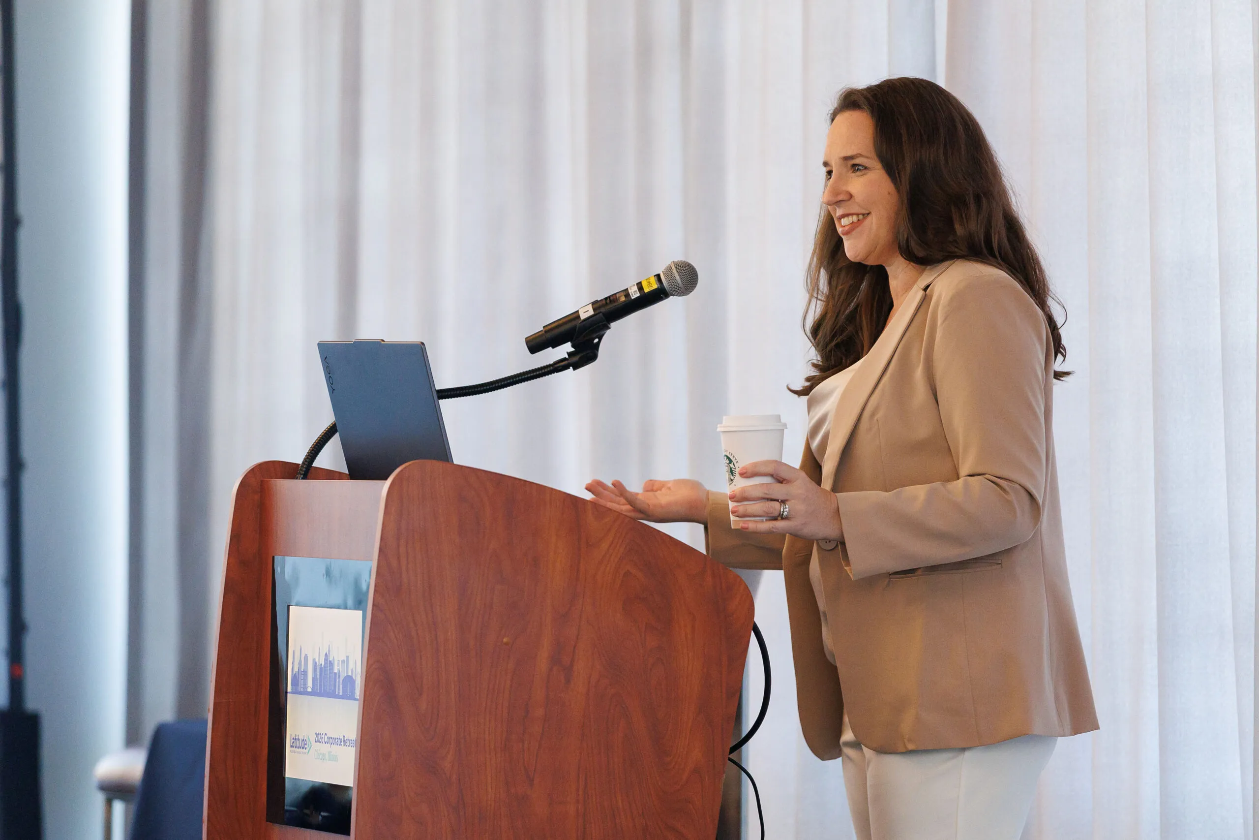female speaker at a podium