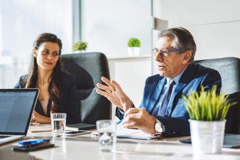 Colleagues on a business meeting in a modern conference room.