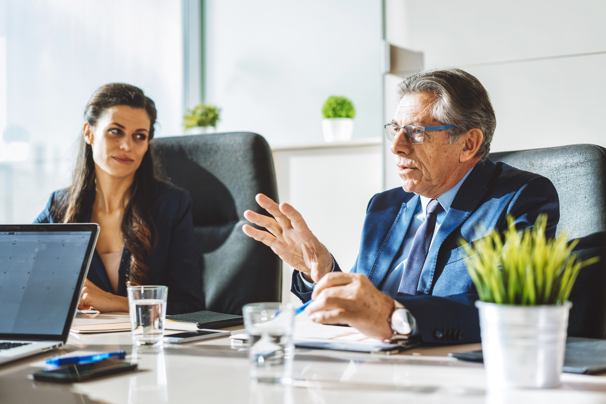 Colleagues on a business meeting in a modern conference room.
